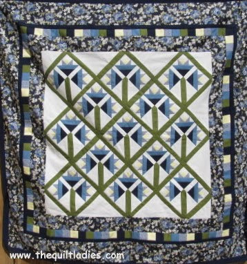 Blue and White Flowered Quilt