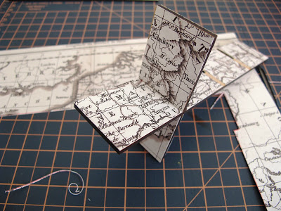 Dry-built modern dolls' house miniature laser-cut 'pidgeon' hole kit  covered in vintage map paper.