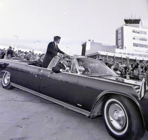 Kennedy's motorcade leaves the airport during a visit to Salt Lake City on September 26, 1963.