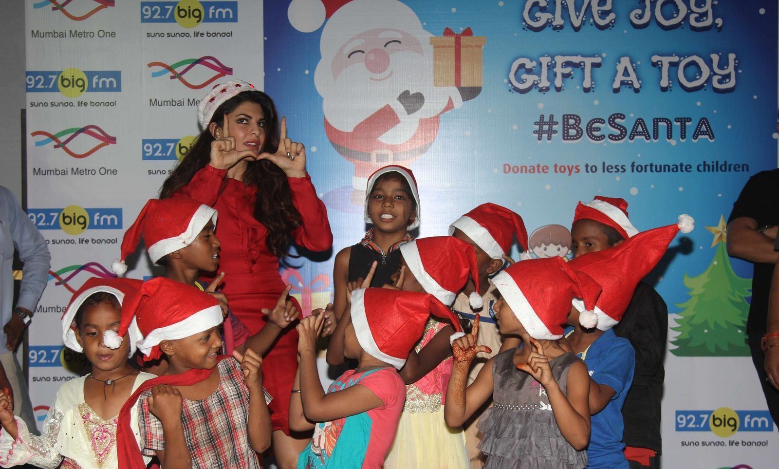 Jacqueline Fernandez Looks Super Sexy In Red Dress As She Celebrates Christmas With The Angel Xpress Foundation in Mumbai