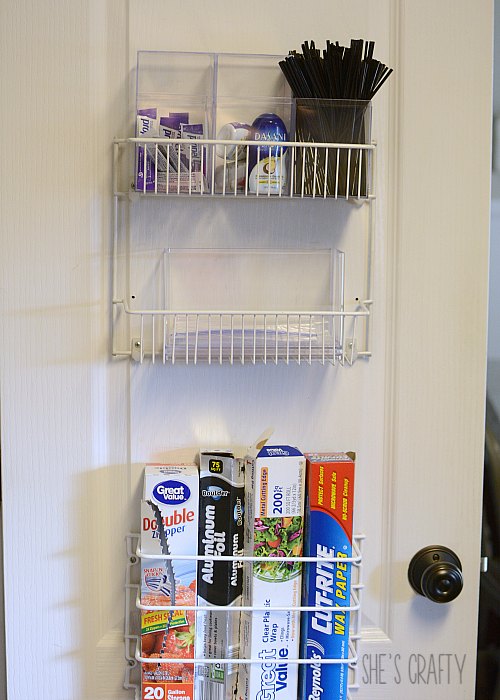 Use pantry door to store plastic wrap and baggies