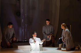 IN REVIEW: bass MATTHEW TREVIÑO as Seneca (center), with (from left to right) tenor NICHOLAS HUFF, baritone NATHANIEL HILL, and soprano NICOLE HEINEN as Seneca's followers, in Florentine Opera's March 2019 production of Claudio Monteverdi's L'INCORONAZIONE DI POPPEA [Photograph by Kathy Wittman, © by Ball Square Films]