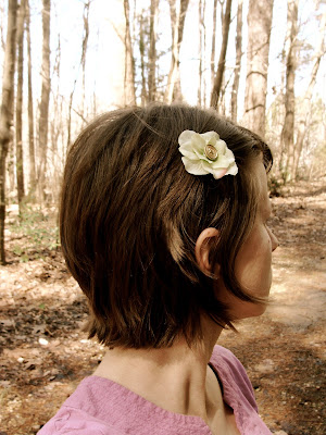 layered short haircut with flower hair accessory