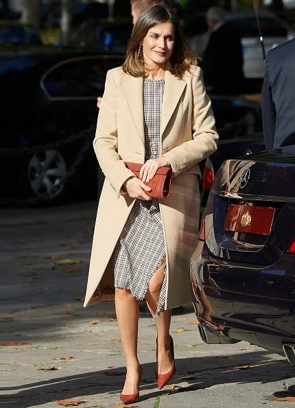 Queen Letizia wore Pedro del Hierro Checked dress and Magrit red pumps, carries Magrit clutch bag. She wore a Checked Dress by Pedro del Hierro
