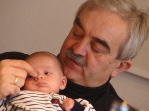 grandpa's finger: baby watching the big, big world. Stock Photo credit: knips