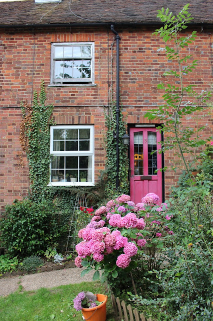Pretty pink doors and hydrangeas in the countryside