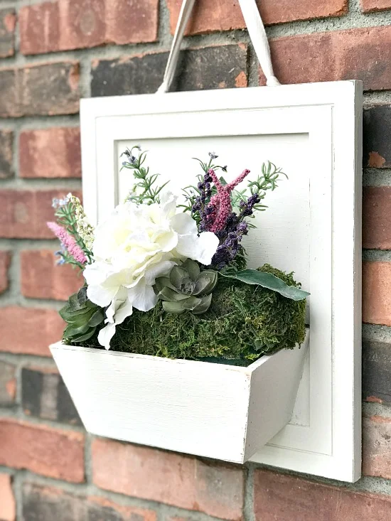 flower box on hanging on brick