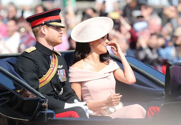 Meghan Markle, The Duchess of Sussex is wearing a dress by Carolina Herrera. The Duchess of Cambridge is wearing a dress by Alexander McQueen. wessex