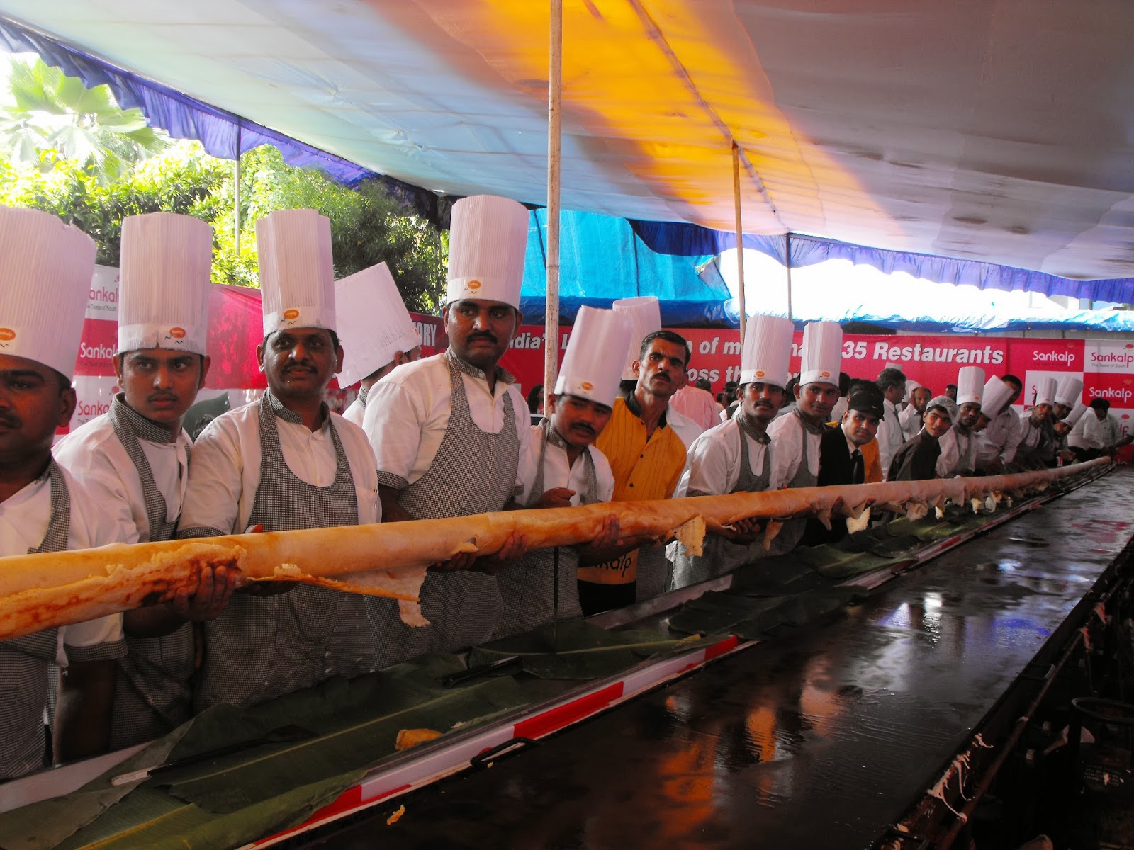 Indian chefs prepare allegedly the longest dosa Images Archival Store