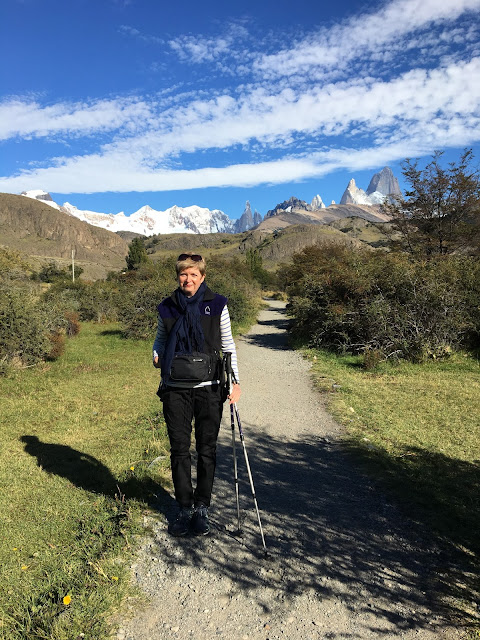 Patagonia: Like Falling in Love. The beginning of the trail to Loma Del Pliegue Tumbado. woman standing on hiking trail in front of snow-capped mountains