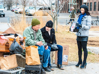 Jonny Lee Miller as Sherlock Holmes helps a homeless man in CBS Elementary Episode # 19 Snow Angels