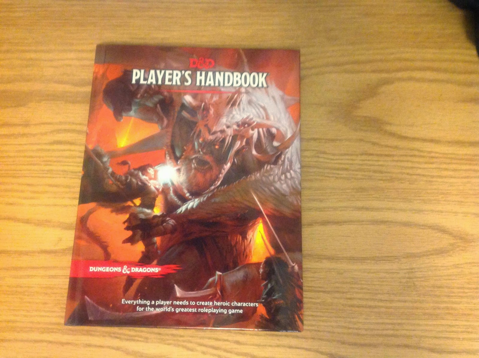 Bat in the Attic 5e PHB in hand