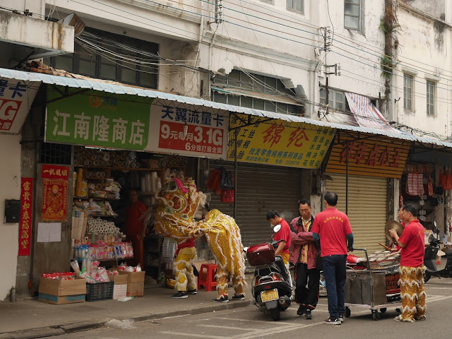 Lion dance troupe at a shop in Jiangmen