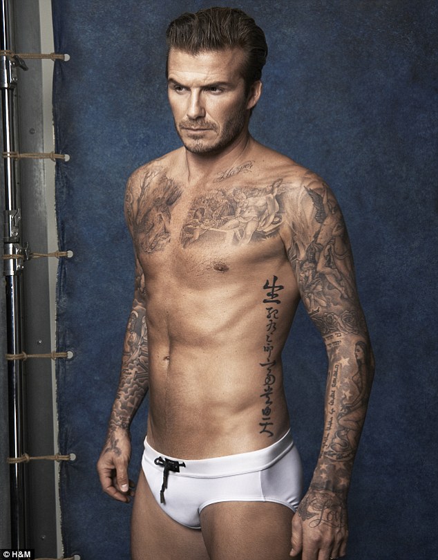 David Beckham in his pants showing off his tattoos