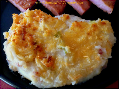 Mashed Potato Casserole: mashed potatoes with all the mix-ins for a fluffy flavorful side dish | Recipe developed by www.BakingInATornado.com | #recipe #potatoes