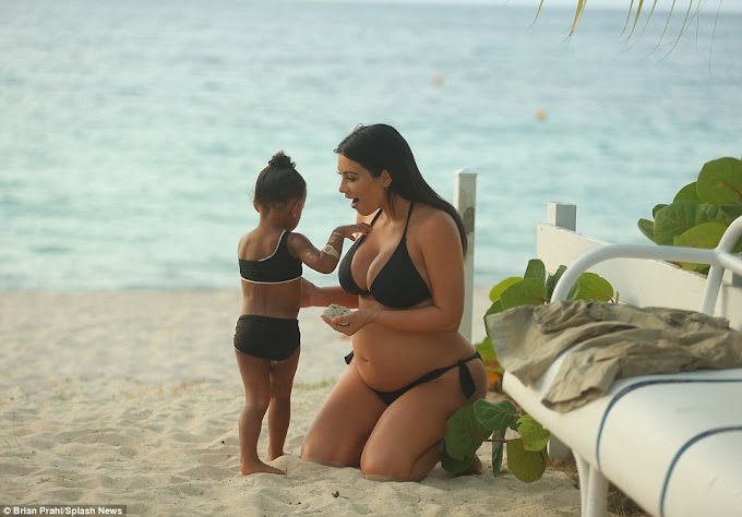 Pregnant Kim Kardashian na  Mwanae North West Wakiwa wamevaa Bikinis za Kufanana Beach.. PICHA