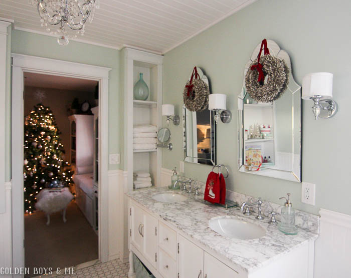 Christmas decor in master bathroom with carrera marble