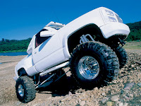 white pick up truck with big wheels