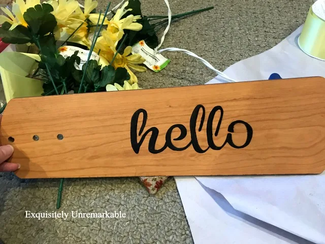 Fan Blade with hello stenciled on it