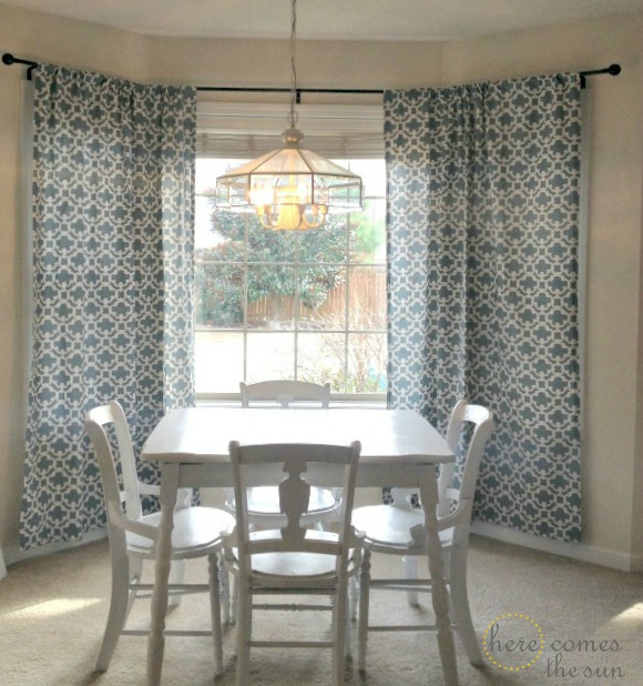 Decorate a Rental with bold curtains and a DIY bay window curtain rod