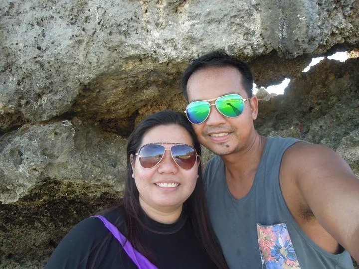 Photo of a couple travel blogger at Willy's Rock in Boracay