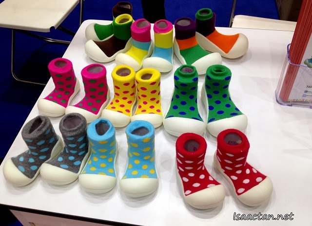 Colourful baby socks attached to a rubber baby shoe
