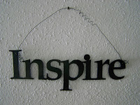 Wall-hanging of the word "Inspire"