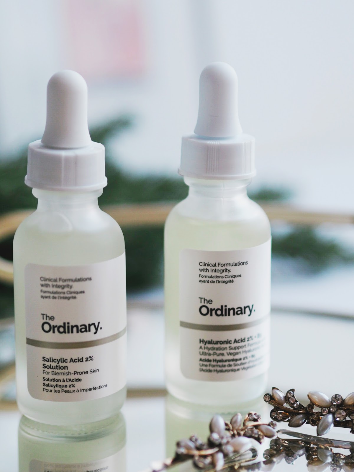 Two clear bottles of the Ordinary Skincare Two acids