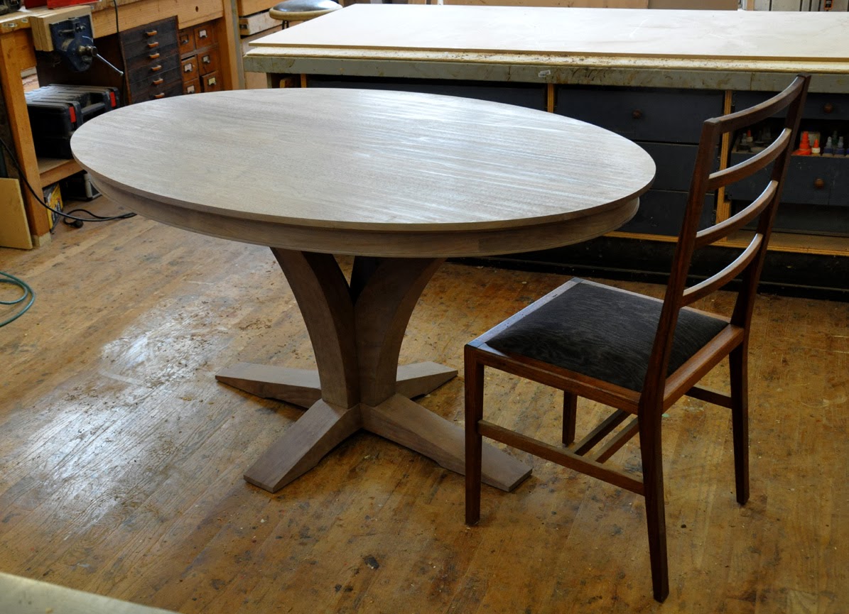 another oval walnut pedestal table