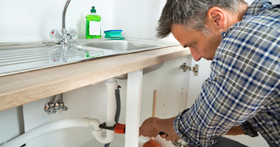 Man making home repairs on a budget