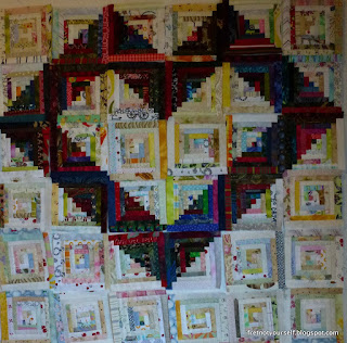 Half-inch logs in dark and light form a heart on this quilt.