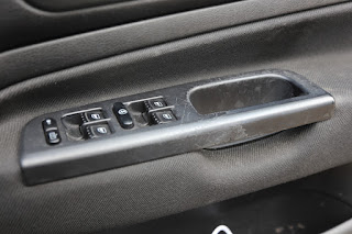 Driver's door trim showing fitment for 4 electric window switches
