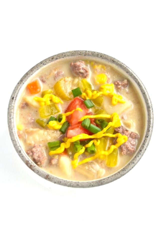 Cheeseburger Soup tastes just like your favorite burger loaded with toppings! It is a lightened up version yet tastes rich and creamy. www.nutritionistreviews.com