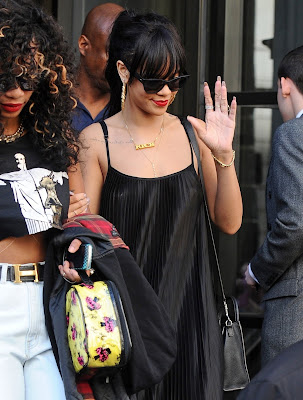 Rihanna flashes nipple piercing as she jets out of LA 