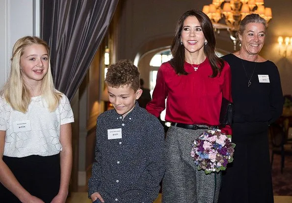 Danish Crown Princess Mary wore Hugo Boss Banora8 blouse and wool trousers at Hotel d'Angleterre in Copenhagen. Danish Heart Association