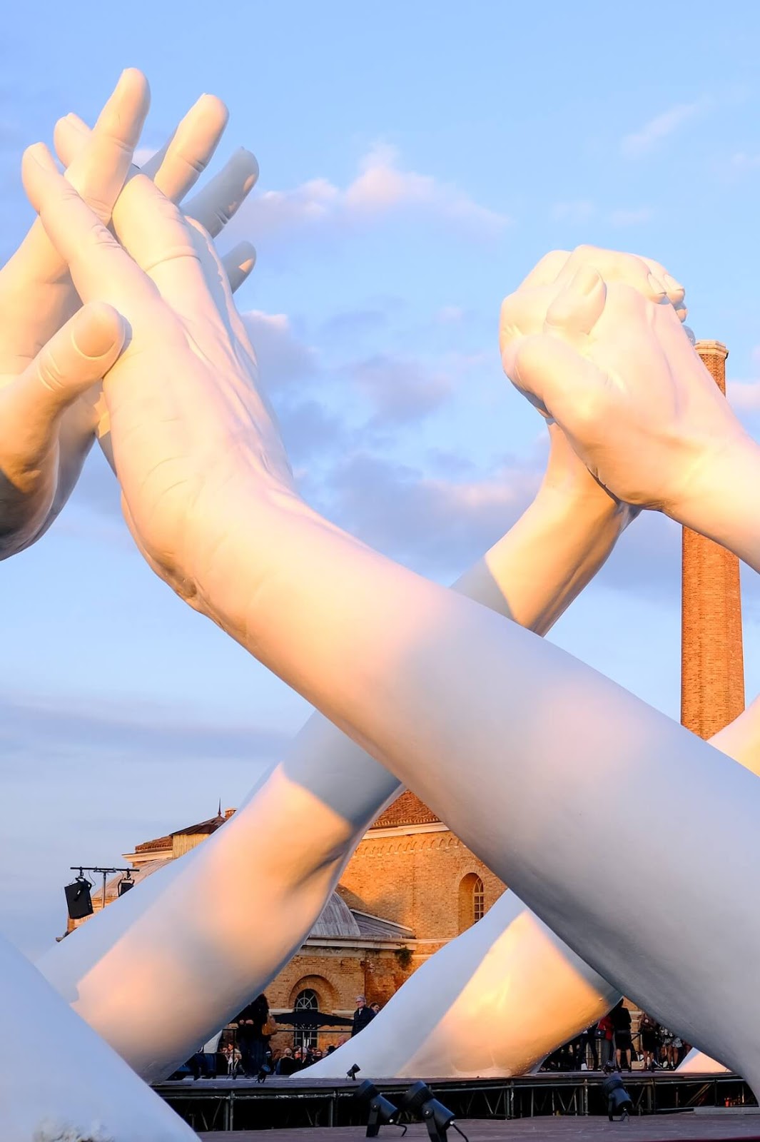 Monumental Installation Of Hands Creating A Bridge Of Unity In Venice