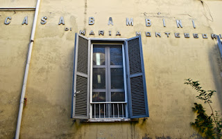 Maria Montessori's name still adorns the wall of the Casa dei Bambini in Rome, which is no longer a Montessori school 