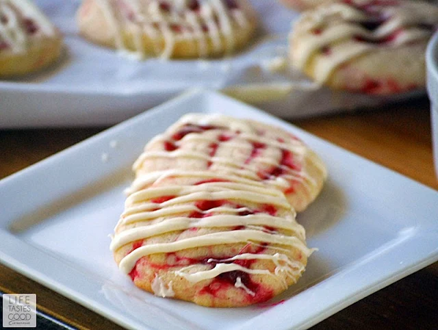 Cranberry Pinwheel Cookies | by Life Tastes Good are beautiful Christmas cookies made from my Vanilla Cookie Dough Recipe. The cranberry filled cookies drizzled with rich, creamy white chocolate are delicious and make a festive cookie for the holiday season.