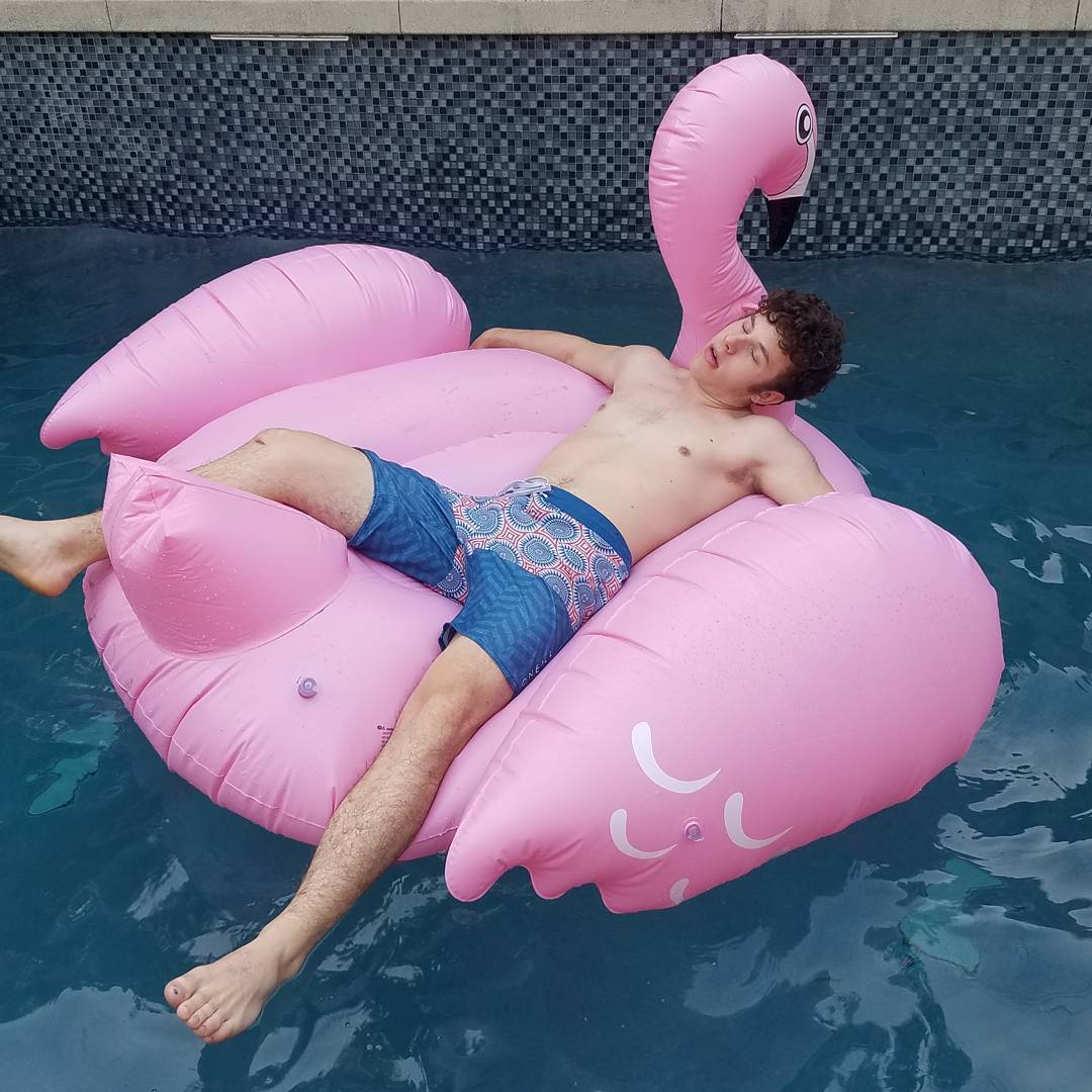 Nolan Gould shirtless in pool.