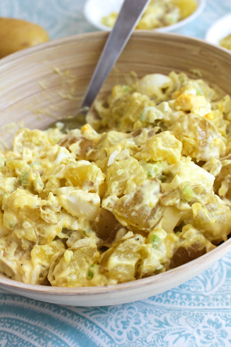 Mom's Traditional Potato Salad is a classic potato salad that is creamy and delicious, made with mayo, mustard, onion, celery, and hard-boiled eggs.  It is the perfect side dish for cookouts, picnics, potlucks, and parties! #potatosalad #sidedish