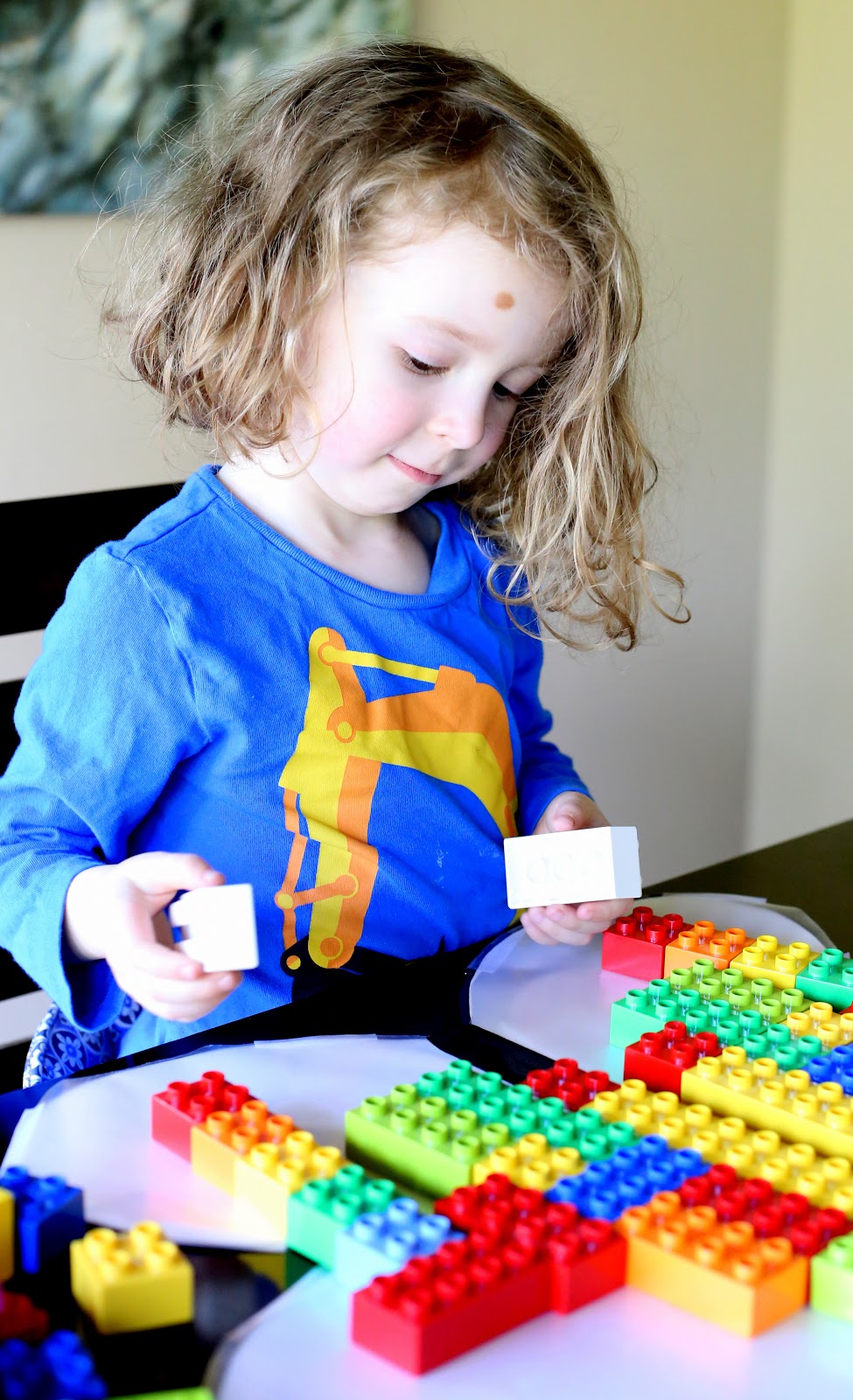 A fun and simple lesson on symmetry using LEGOs and a sticky-winged butterfly from Fun at Home with Kids