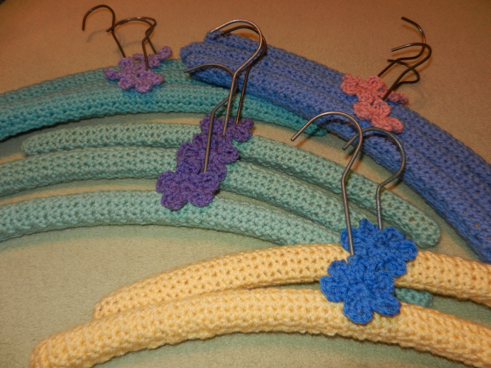 Yarni Gras! stash busting! crocheted wooden hangers