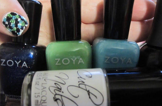 Bottle shot:  Zoya Indigo, Josie, and Rocky, Finger Paints Black Expressionism, and Cult Nails Tempest.