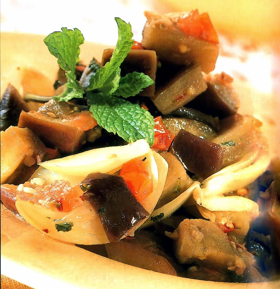 Sweet and Sour Eggplant: A vegetarian dish that is an interesting blend of Asian and North African. Eggplants (aubergines) parboiled with garlic, onion and tomatoes that are finished in a sweet and sour sauce with chilii flakes and which is served dressed with garden mint. Easy to make, tasty and healthy too!!
