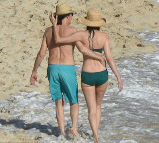 In an aqua trunks, Paul McCartney, 73, accompanied his beautiful 5 years lover, Nancy Shevell, 56, for walking in a green bikini as The couple seemed very enjoy the St Barts situation of beach on Sunday afternoon, December 27, 2015.