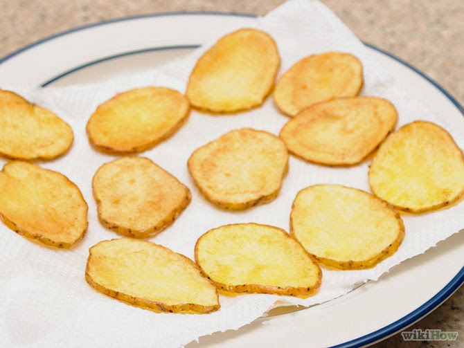 Once removed, put the chips on a plate with a paper towel over it to