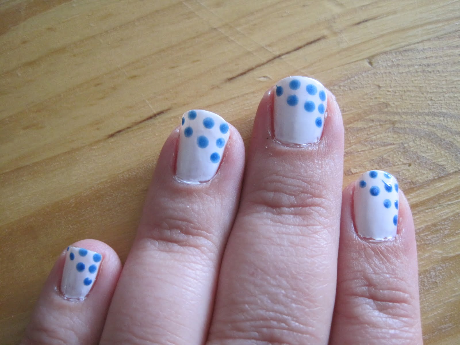 dragon nails & design white with blue dots