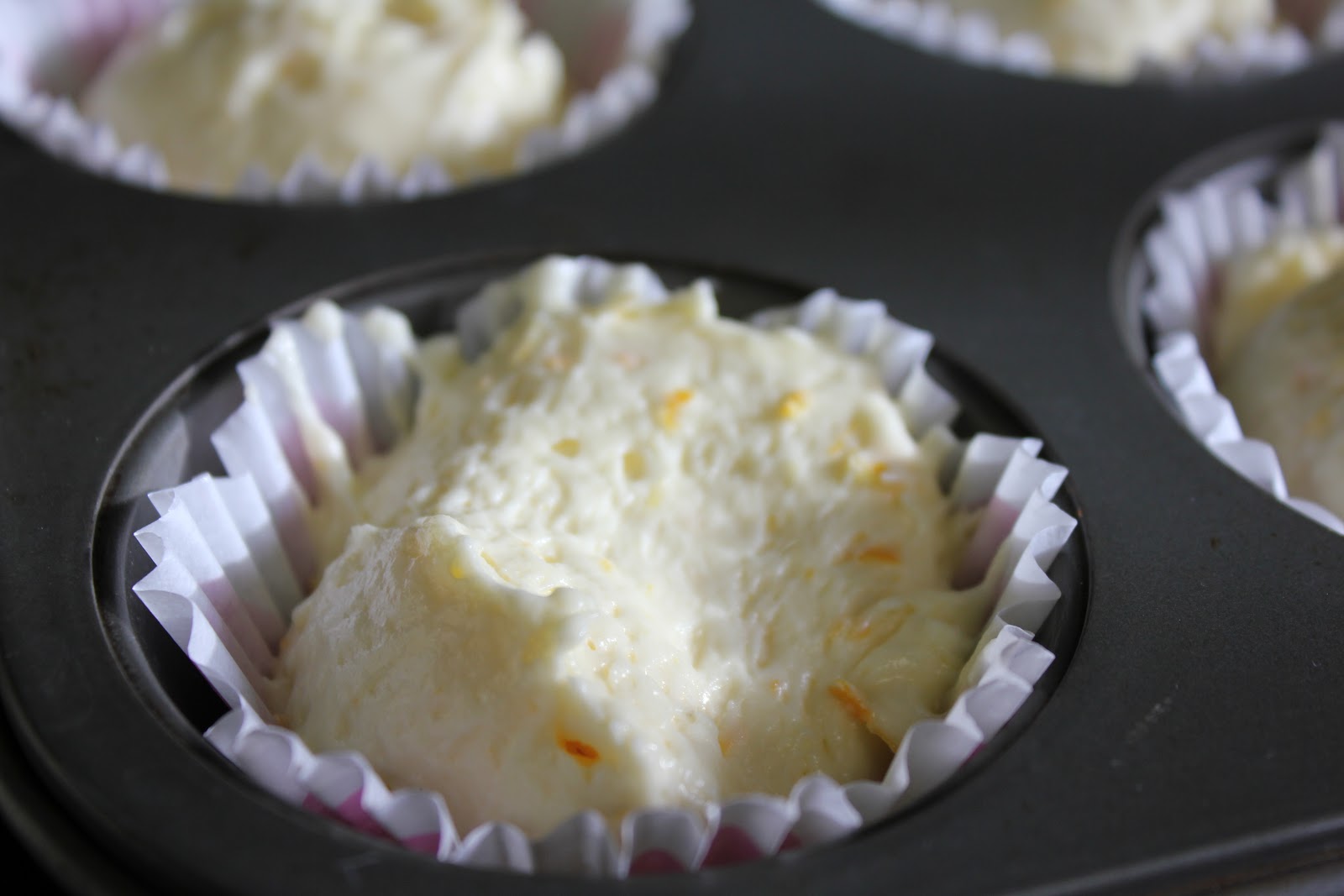 Girls in Aprons: Orange cupcakes with raspberry cream cheese frosting