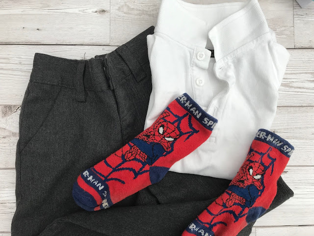 A photo of school uniform with some spiderman socks