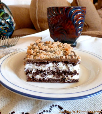 Toffee S’more Refrigerator Bars, chocolate, whipped marshmallow, caramel and toffee crunch blend together in the refrigerator to make these easy and delicious dessert bars. | Recipe developed by www.BakingInATornado.com | #recipe #dessert